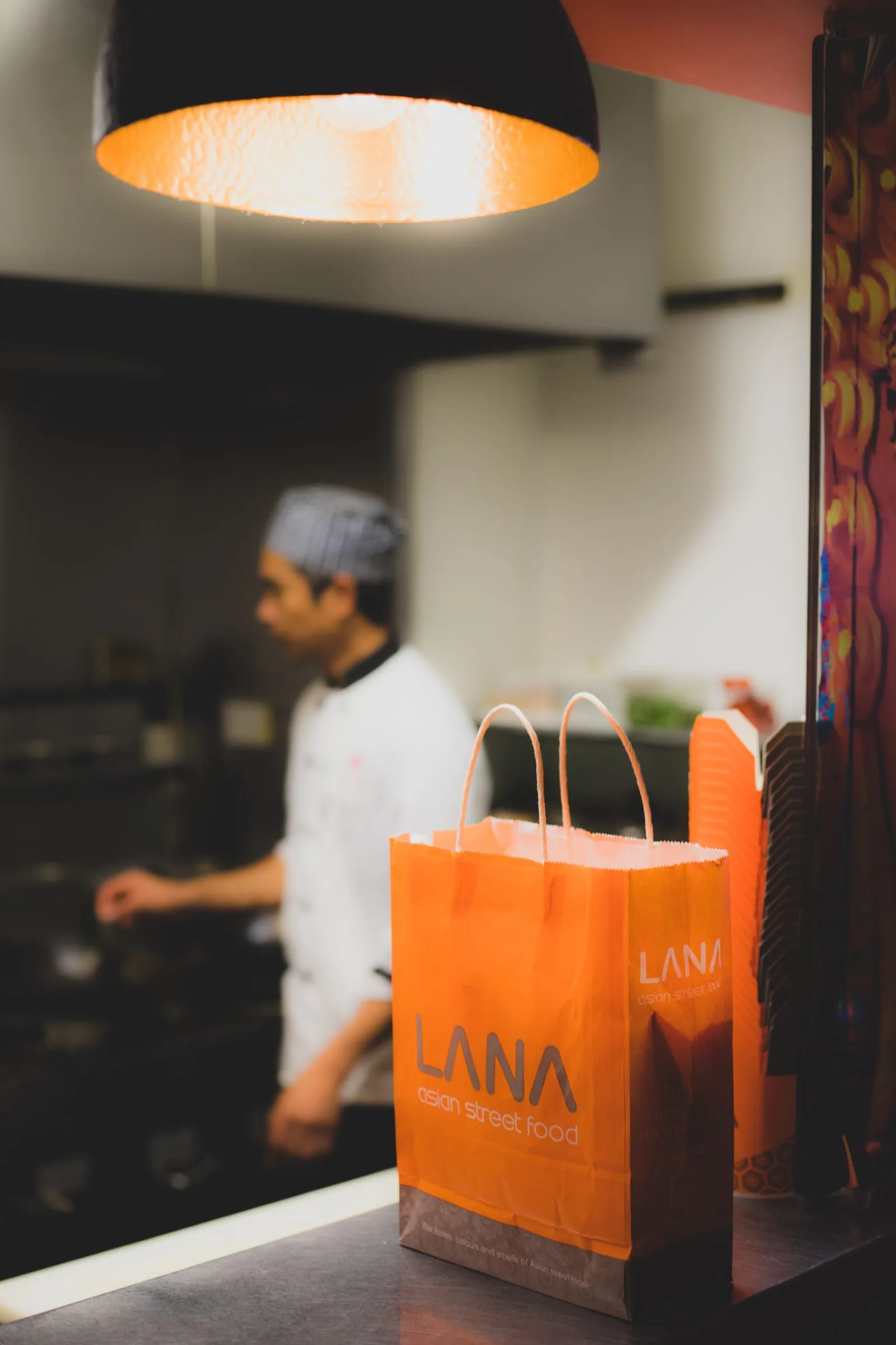 LANA takeaway bag shows brand identity design for restaurants.