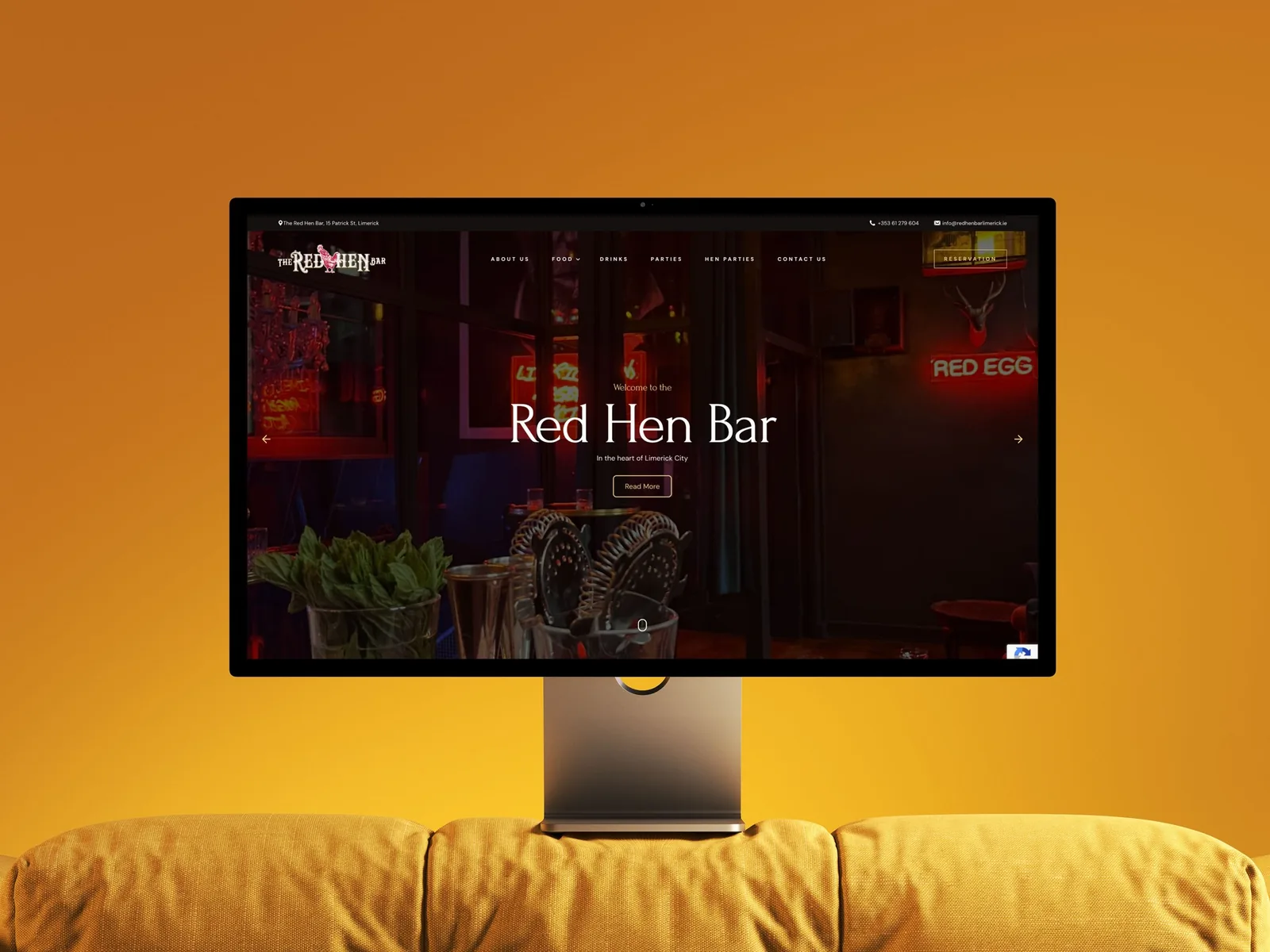 Bar website design for The Red Hen Bar on a monitor.