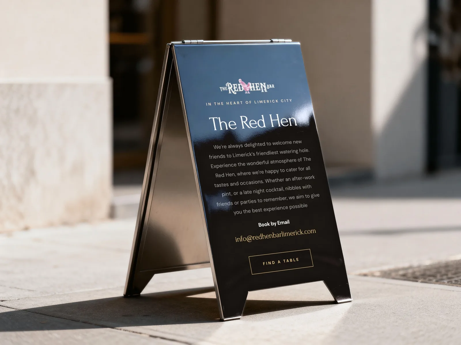 A-board sign for The Red Hen Bar with 'Find a Table' CTA for website design.