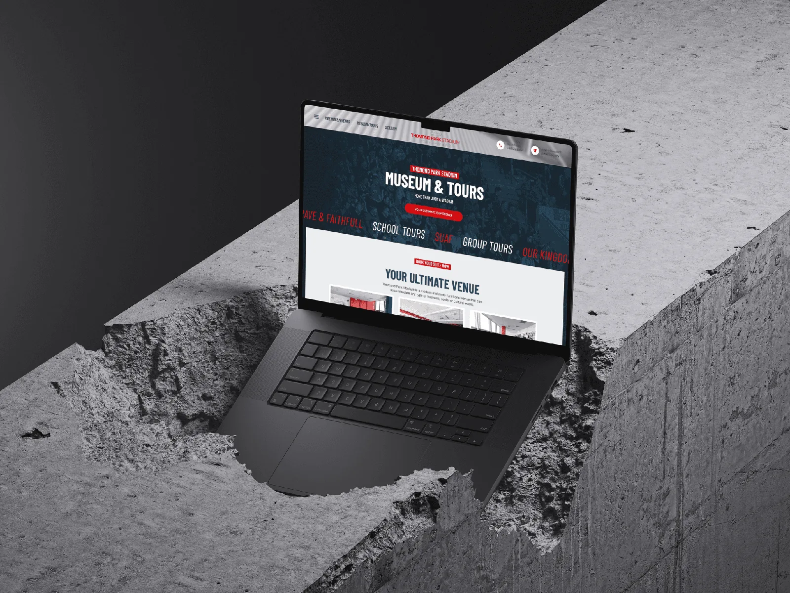Sleek website design on a laptop embedded in concrete.