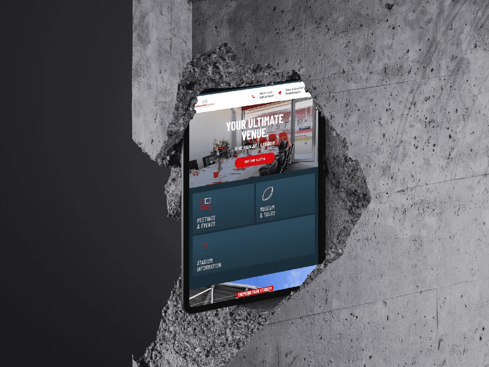 Tablet displaying venue website design for events and stadium information.