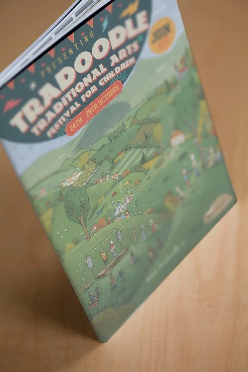 Festival brochure featuring playful illustration and strong brand identity design.